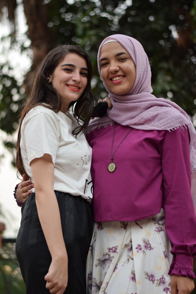 woman-taking-photo-with-another-woman-near-trees-1508336